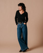 Load image into Gallery viewer, The Lewis is a long-sleeved, V-neck black T-shirt with a ribbed neckline finished in iridescent lurex. Glamourous yet relaxed style, wear smart or casual.