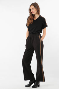 black wearable trouser with copper glitter stripe down the side seam.  Elasticated waist in soft fabric.  Wear with trainers or heels for evening.