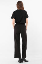 Load image into Gallery viewer, black wearable trouser with copper glitter stripe down the side seam.  Elasticated waist in soft fabric.  Plain back with no pockets.