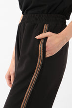 Load image into Gallery viewer, black wearable trouser with copper glitter stripe down the side seam.  Elasticated waist in soft fabric