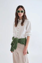 Load image into Gallery viewer, Compania Fantastica white cotton shirt with colourful decorative buttons.  The model looks stylish but relaxed with collared shirt and elasticated cuffs.