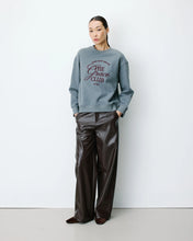 Load image into Gallery viewer, The Grace and Mila Armandio sweatshirt features a relaxed oversized silhouette so it is comfortable and easy to wear, inspired by classic college style. This sweatshirt has long sleeves, a crew neck with a printed slogan on the front and ribbed trims at the cuff.