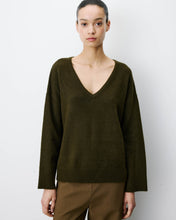 Load image into Gallery viewer, The Grace and Mila Salvador khaki jumper, crafted from a subtle lurex knit, it has the softest shimmer giving it a certain elegance. It has a relaxed fit, long sleeves, v-neckline and small side slits with ribbed finished cuffs.  Simple yet stylish, easy to wear and a classic for your wardrobe.