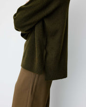 Load image into Gallery viewer, The Grace and Mila Salvador khaki jumper, crafted from a subtle lurex knit, it has the softest shimmer giving it a certain elegance. It has a relaxed fit, long sleeves, v-neckline and small side slits with ribbed finished cuffs.  Simple yet stylish, easy to wear and a classic for your wardrobe.