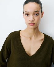 Load image into Gallery viewer, The Grace and Mila Salvador khaki jumper, crafted from a subtle lurex knit, it has the softest shimmer giving it a certain elegance. It has a relaxed fit, long sleeves, v-neckline and small side slits with ribbed finished cuffs.  Simple yet stylish, easy to wear and a classic for your wardrobe.