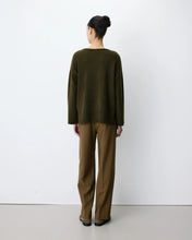 Load image into Gallery viewer, The Grace and Mila Salvador khaki jumper, crafted from a subtle lurex knit, it has the softest shimmer giving it a certain elegance. It has a relaxed fit, long sleeves, v-neckline and small side slits with ribbed finished cuffs.  Simple yet stylish, easy to wear and a classic for your wardrobe.