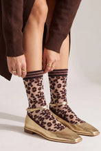 Load image into Gallery viewer, A pair of fun leopard print sheer socks in classic brown print.  They feature a premium combed cotton sole. Designed for a supremely comfortable fit, so not only fabulous, comfy to wear as well!   Super stylish to wear with pumps!
